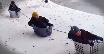 Dad Takes Kids On Amazing Laundry Basket Sleigh Ride