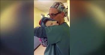 Surgical Assistant Comforts Scared Dog After Surgery