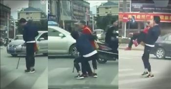 Young Man Drops Everything To Help Elderly Woman Cross Street