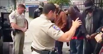 Police Officers Pray With Homeless Before Meal