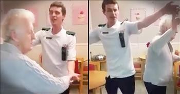 Care Giver Dances With 80-Year-Old Woman At Senior Home
