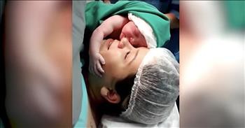 Newborn Clings To Mother's Face After Birth