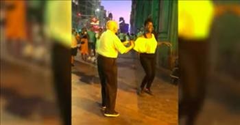Elderly Man Dances With Street Busker