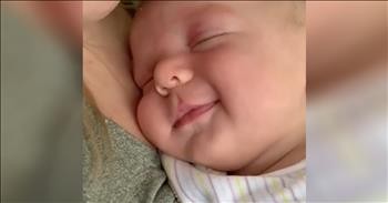 Precious Baby Smiles In Sleep At Mommy's Kisses