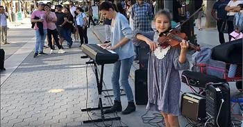 Mother-Daughter Piano And Violin Performance On The Street