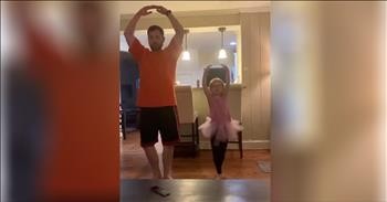 Daddy Helps Daughter Practice Ballet Moves At Home
