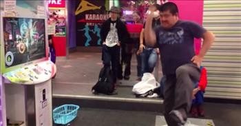 Older Man Steps Up To Dance Machine And Wows The Crowd With His Moves