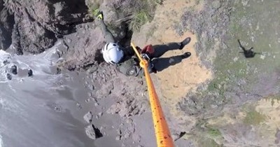 You'll Hold Your Breath During this Daring Rescue of a Dog Trapped on a Cliff 