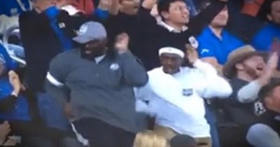 Father and Son Sure Are ‘Happy’ to be at This Basketball Game 