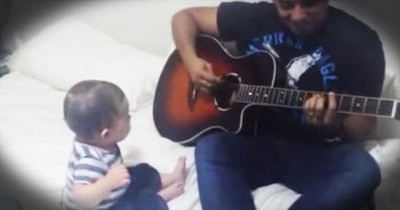 Baby Laughs Hysterically at Dad's Guitar Performance 