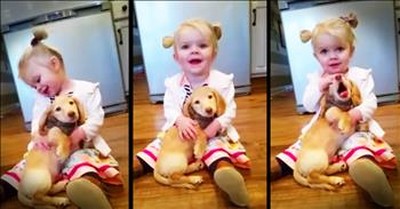 Little Girl And Her Puppy Share Precious Snuggles 