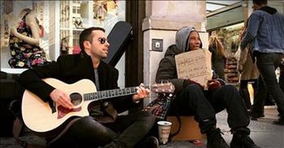 Musician Sits Next To The Homeless And Plays To Help Them  