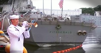 Sailor Plays Taps For Fallen Shipmates