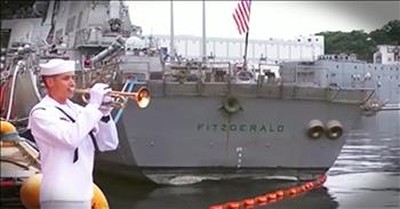 Sailor Plays Taps For Fallen Shipmates 