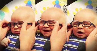 Baby With Glasses Smiles At Momma 