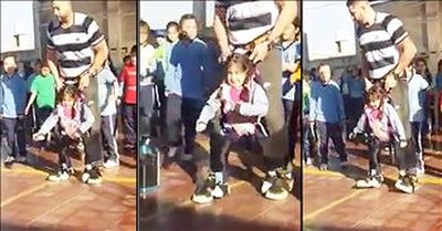 PE Teacher And Girl With Disability Dance  