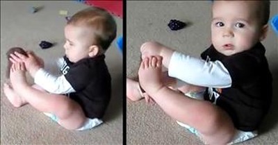 Funny Baby Tries To Put Sock On 