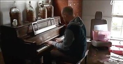 Musician Plays Piano In Flooded Home 
