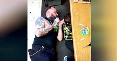 Barber Lays On The Floor For Boy With Autism 