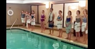 Children's Choir Sing Hymn Around Pool 
