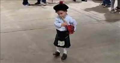 Toddler Plays Along With Bagpipes 