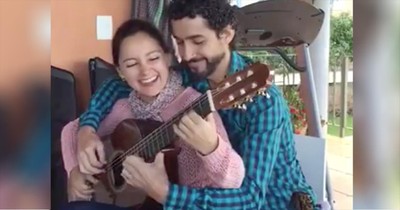 Couple Plays One Guitar At The Same Time