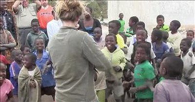 Girl Plays Fiddle For Children Who've Never Heard One 