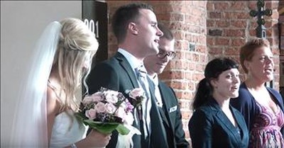 Groom Serenades Bride With Choir During Wedding 