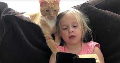 Little Girl Reads Unique Bible Story To Cat 