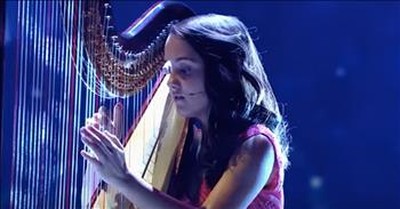 Child Prodigy Daria Vacaroiu Performs Harp Rendition Of 'Believe'  