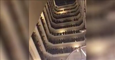 Choir Sings 'Down To The River To Pray' On Hotel Balcony 