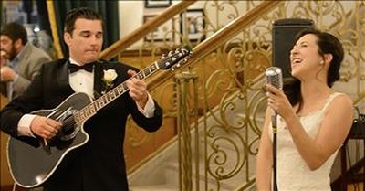 Bride And Groom Sing Acoustic Rendition Of 'At Last' For Guests 