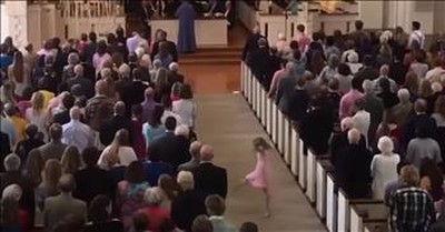 Little Girl Dances In Aisle During Church Service 