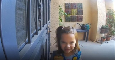 Adorable Girl Scout Practices Her Sales Pitch