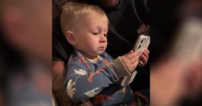 Toddler Tears Up Looking At Pictures Of His Parents