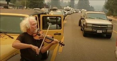 Man Plays Violin In The Middle Of Traffic As Resident Flee Wildfires 