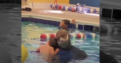 Baby And Swim Instructor Share Sweet Moment During Lesson