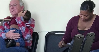 Grandfather Holds Stranger's Sleeping Baby In Waiting Room