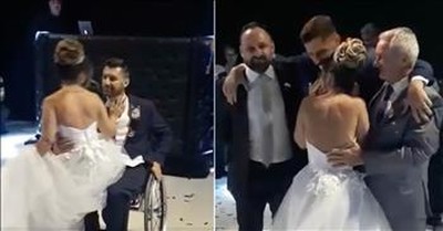 Groomsmen Help Groom Stand Up So He Can Dance With His Bride 