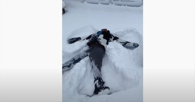Man From Nigeria Enjoys His First Snow By Making A Snow Angel