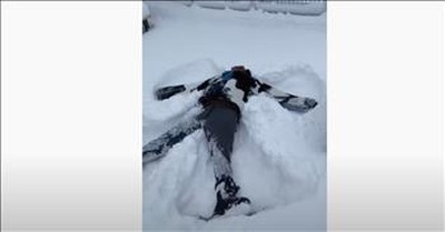 Man From Nigeria Enjoys His First Snow By Making A Snow Angel 