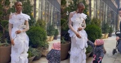 Sweet Moment Little Girl Stops To Admire Model's Beautiful Dress 