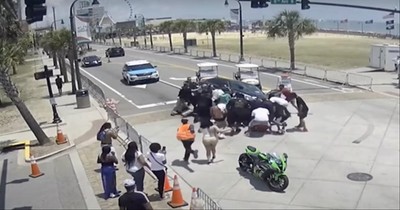 20 People Rush To Lift Car Off Of Motorcyclist