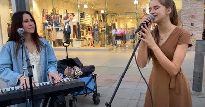 Mother-Daughter Street Performers Sing 'Unchained Melody' Duet