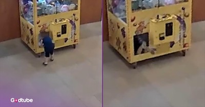 Child Climbs Into Claw Machine and Gets Himself Stuck