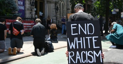people praying for an end of racism, New York church to devote $200,000 to reparations