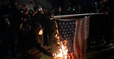 protestors in Portland burning an American flag, Protestors destroy Church
