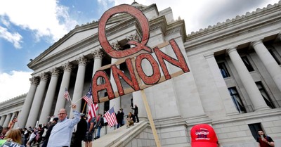A QAnon sign, more than a quarter of White Evangelicals believe in some core conspiracies