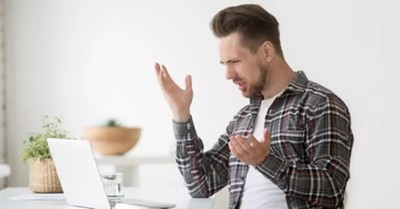 A man using his computer frustratedly, Evangelical Self Flagellation Isn’t Prophetic Witness