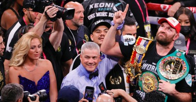 Tyson Fury holding heavyweight boxing championship belt, Tyson Fury praises God after winning championship